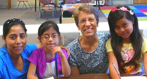 Imelda Velasquez Diaz (first on left) and Nancy Sollenberger Heishman (second from right) serving with the children’s ministry at West Charleston Church of the Brethren. Photo by Mary Bowman